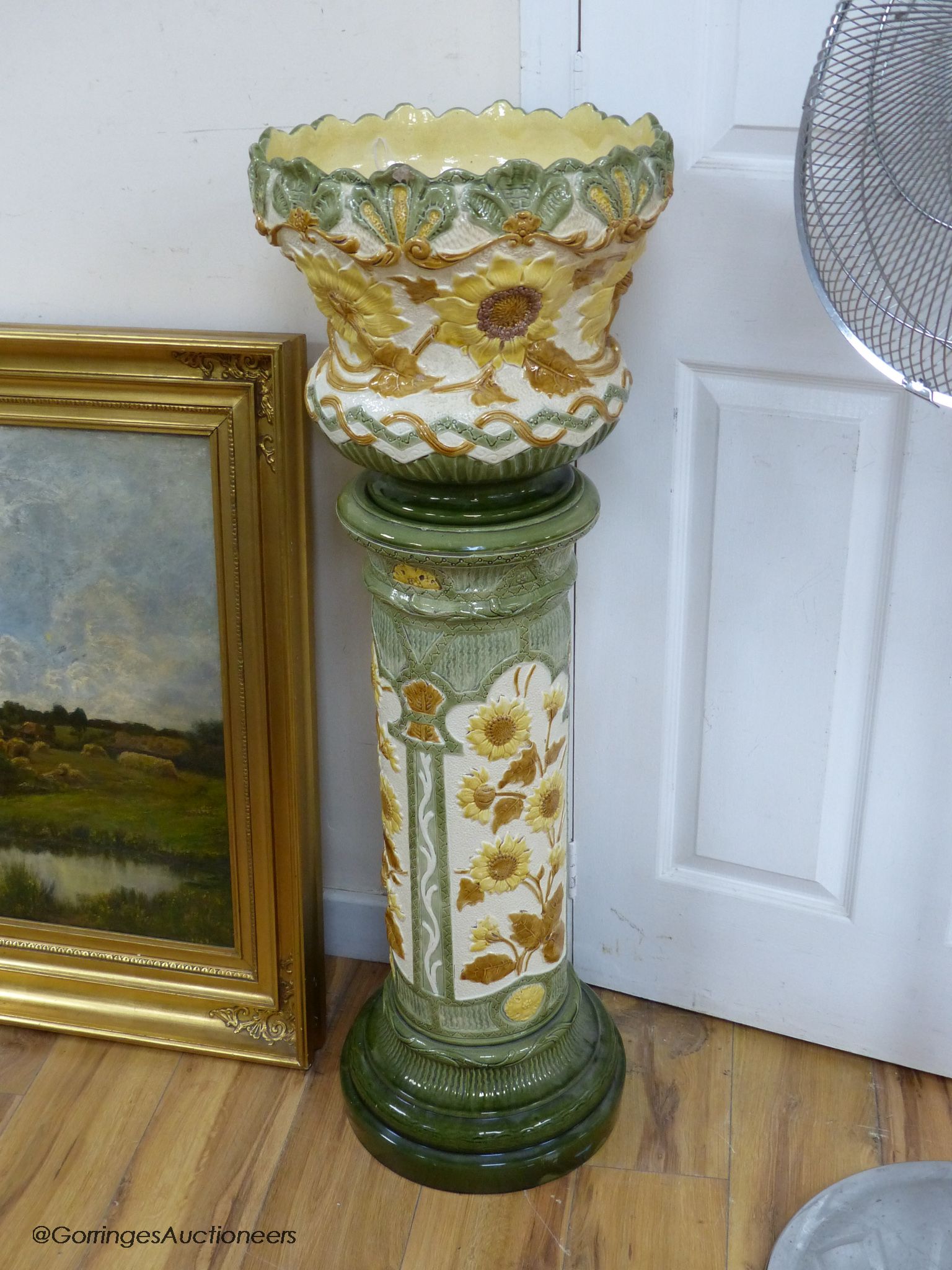 A Burmantofts faience jardiniere on pedestal, 105cm high